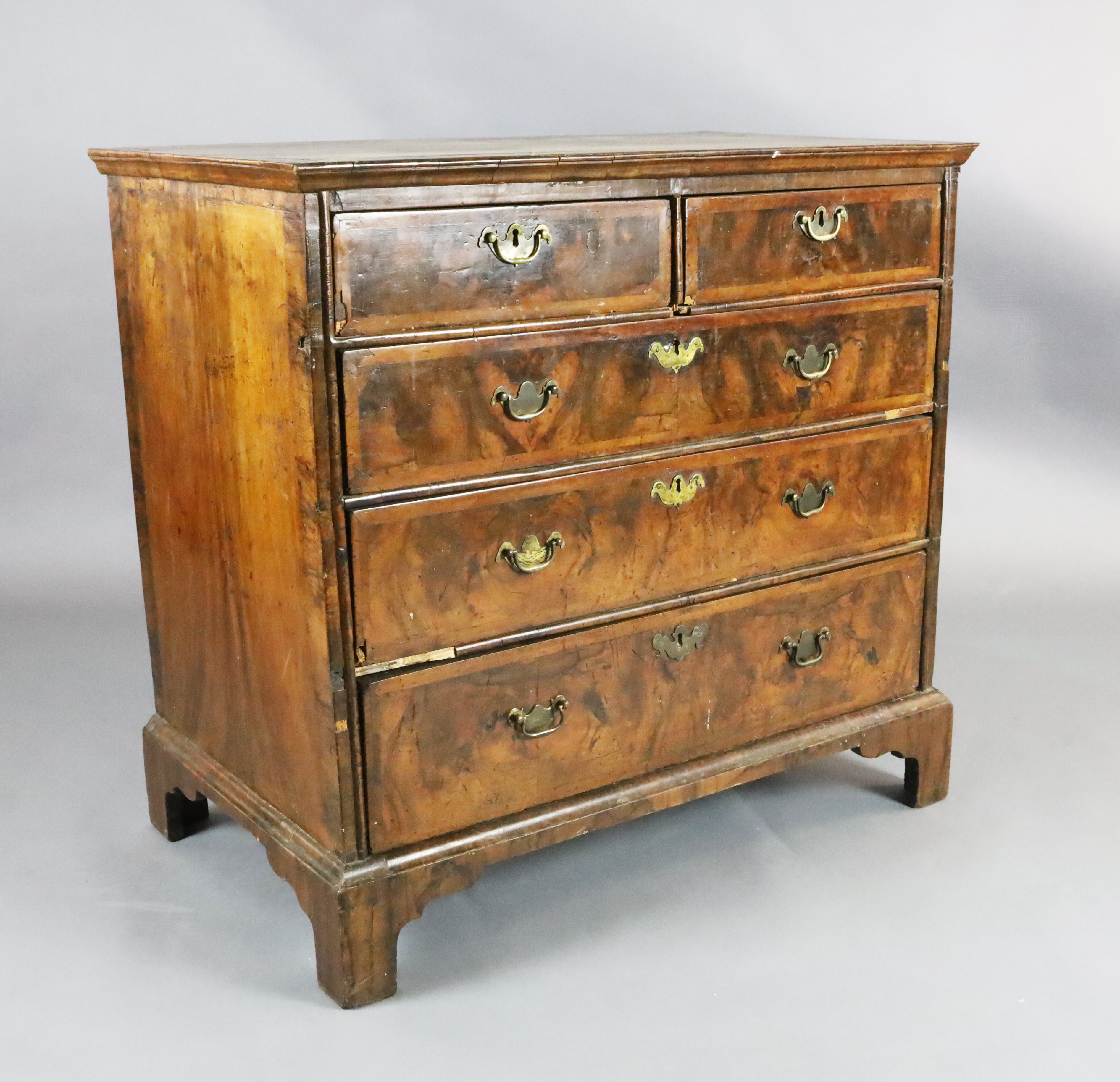 A George III featherbanded walnut chest W.3ft 2.5in. D.1ft 11in. H.3ft